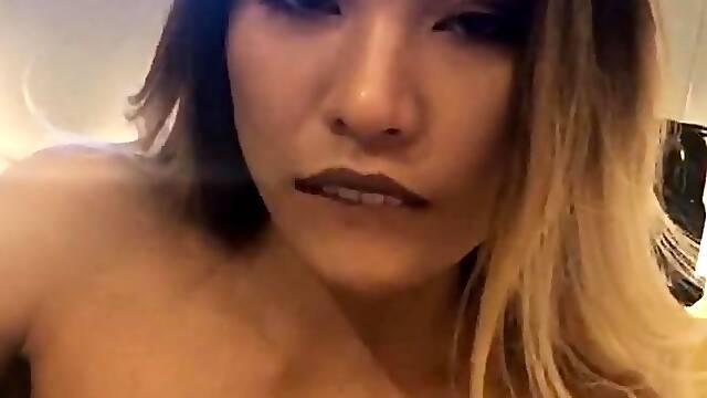 Small titted asian beauty giving blowjob