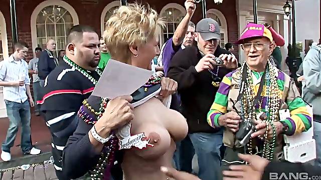 Slutty and shameless chicks show their big tits in the public