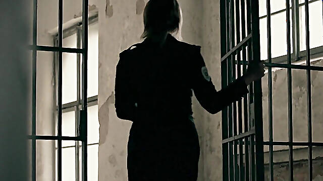 The luscious prison guard handles hard her prisoners