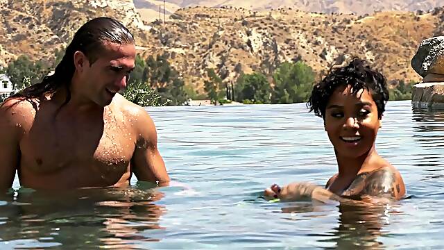 Sexy babe Honey Gold fucks a handsome lover on a beach